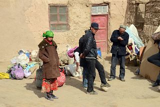 01 Waiting For The Camels In Yilik Village With Village Headman And His Family